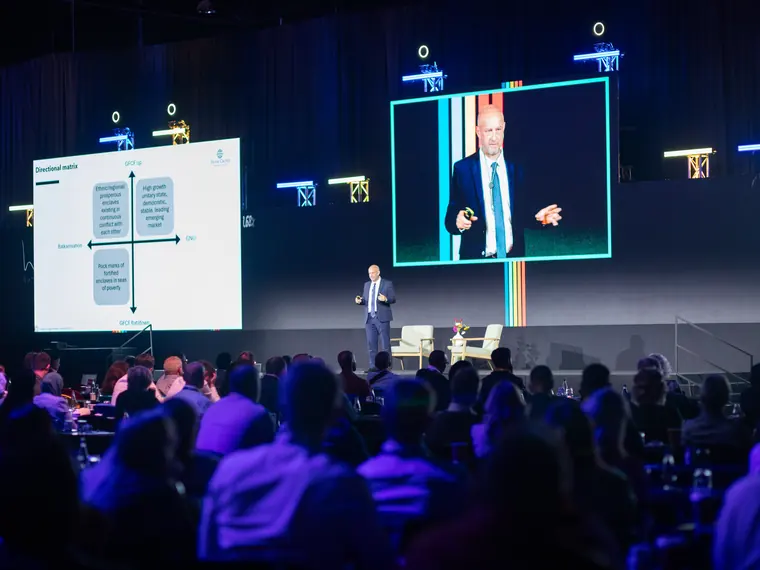 The Investment Forum 2026 — a speaker on stage addressing the audience